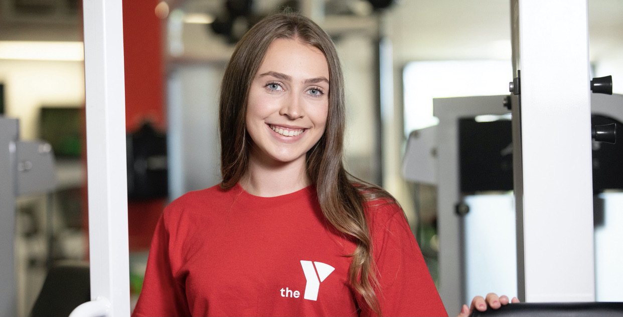 Smiling YMCA staff member in the gym